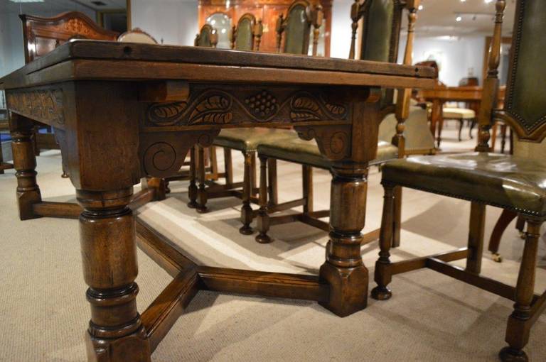 An Oak Jacobean Style Refectory Table And Set Of 12 Oak Dining Chairs. 2