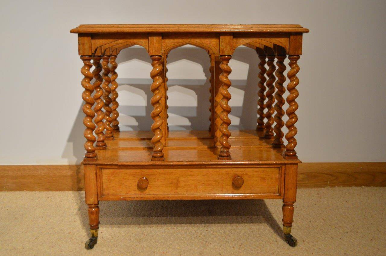 A classical oak English Victorian Period canterbury by Miles & Edwards, Oxford Street, London. Constructed with the finest English oak, having a stepped moulded frame with three internal divisions, finely turned barley twist supports and