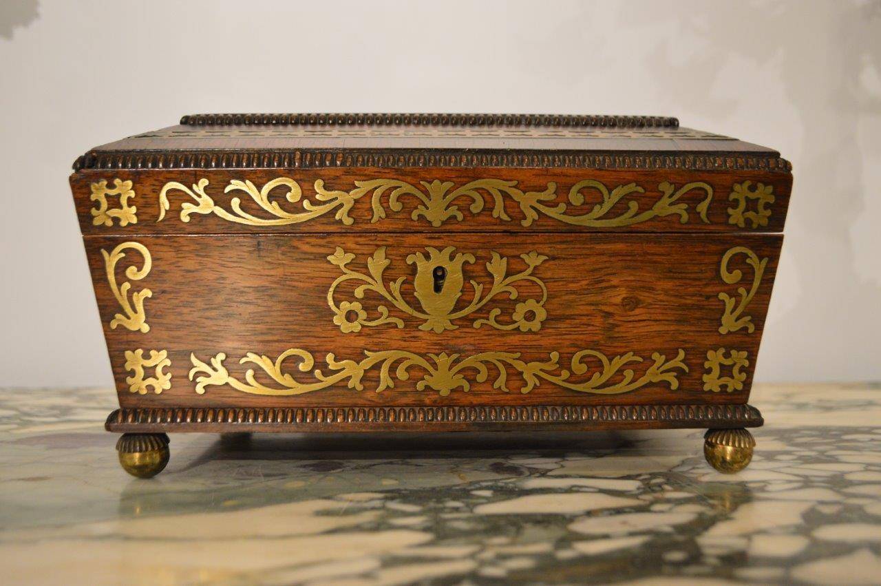 A Regency Period brass inlaid ladies work box made by Joseph Gianetti Of Edinburgh. The hinged lid having cut brass inlaid detail opening to reveal a silk lined drop down compartment with beautiful quality embossed and gilded detail and a vacant