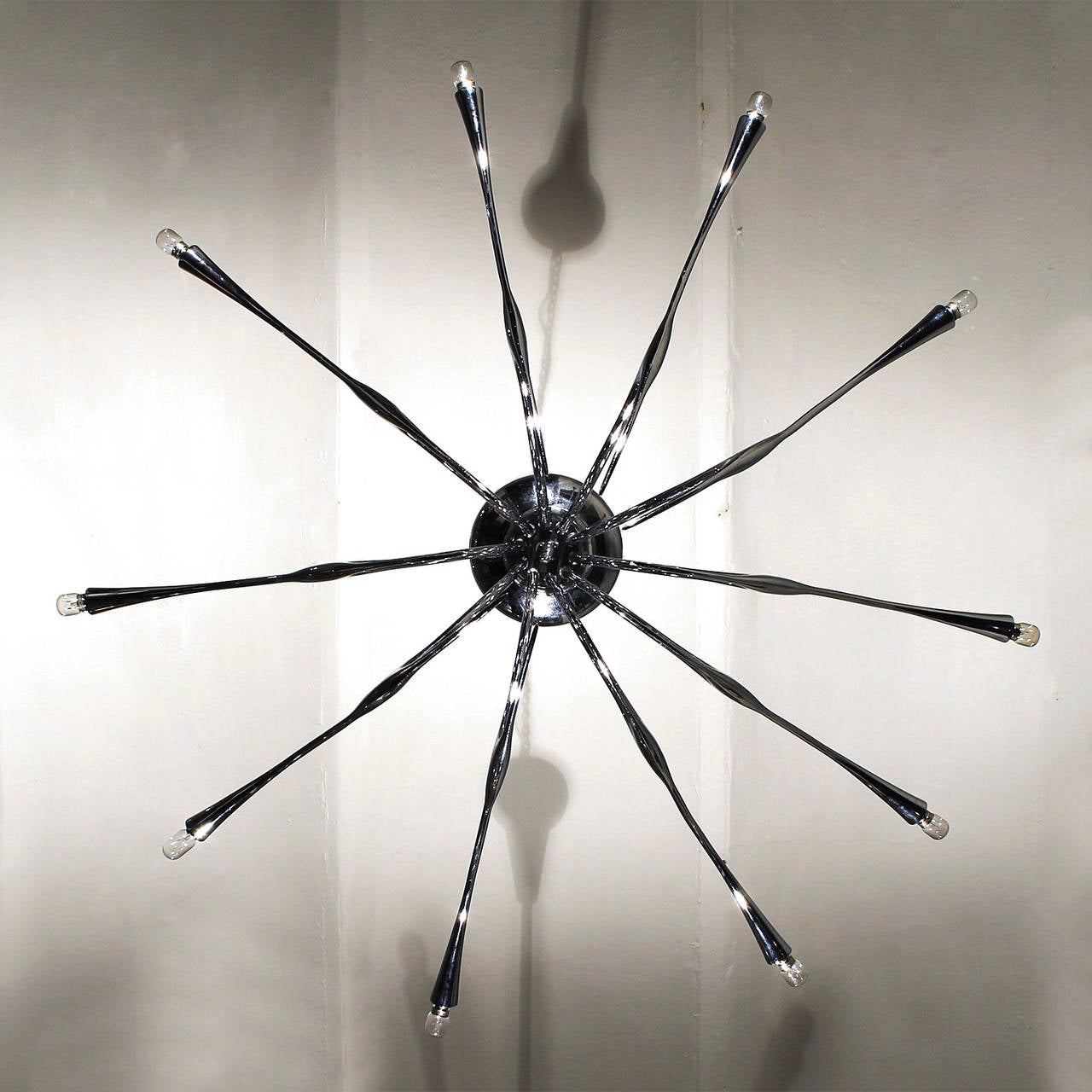 Spectacular 10 lights chandelier, nickel plated brass, rewired.
Design: Oscar Torlasco
Edited: Lumi Roma
Italy 1955

Bibliography: A ceiling lamp by O. Torlasco