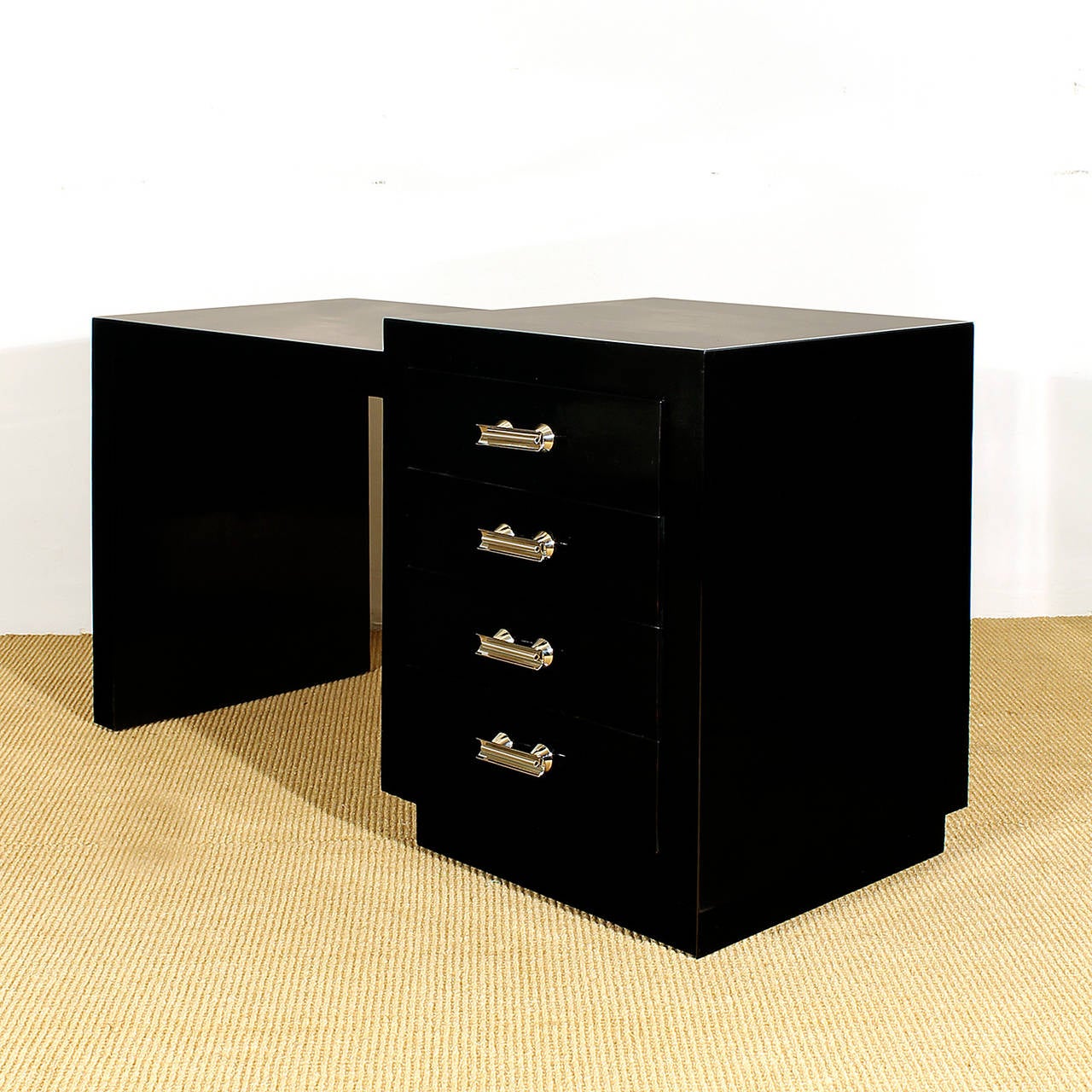 Art Deco cubist console-desk, stained and varnished sapelli, french polish, nickel plated brass handles.
Spain c. 1930