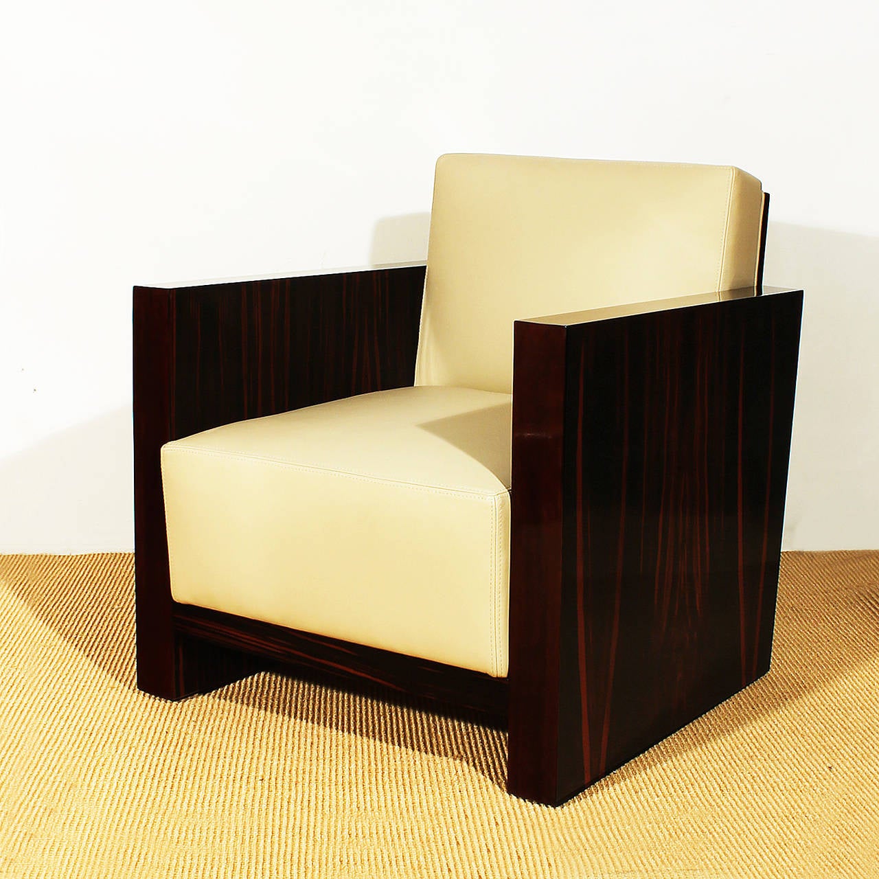 Splendid pair of Art Deco cubist armchairs, solid oak with differents veneers, one with mahogany and Macassar ebony veneer and the other one with mahogany and zebra wood veneer, french polish, new taupe grey leather upholstery, saddle point