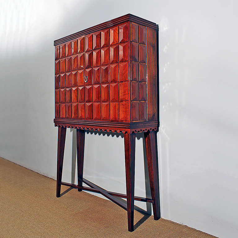 Solid cherrywood dry bar cabinet, 2 diamond points doors, mirrors mosaic inside and glass shelves on the doors.
Attributed to Paolo Buffa.