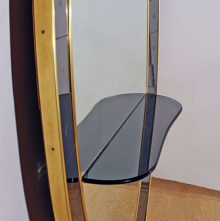Brass 1950s Mirror-Console made by Cristalarte. Blue engraved mirror frame. Italy 