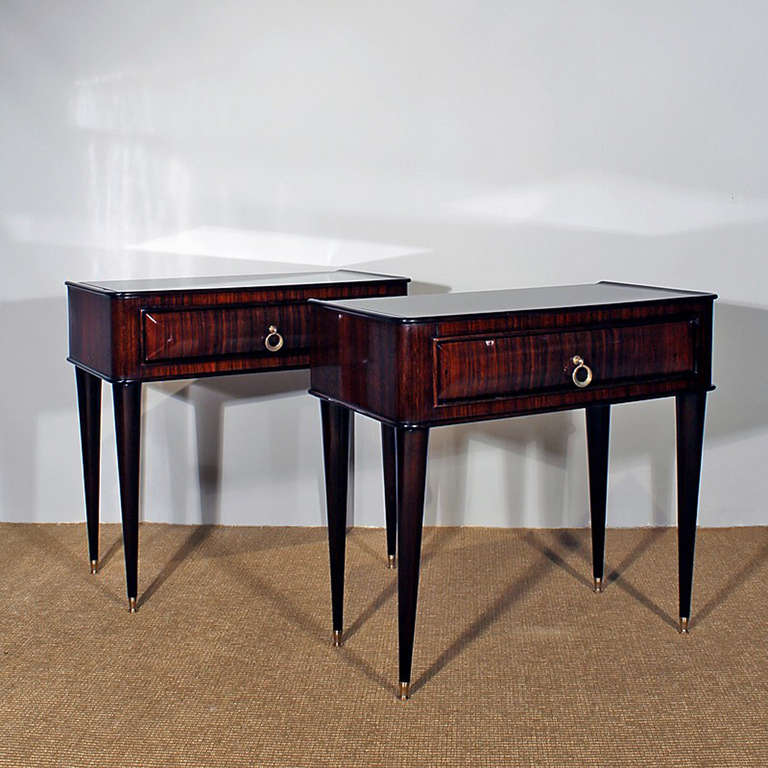 Pair of bedside tables, solid mahogany and rosewood veneer, black opaline on top, polished brass feet and handles.
Italy c. 1940