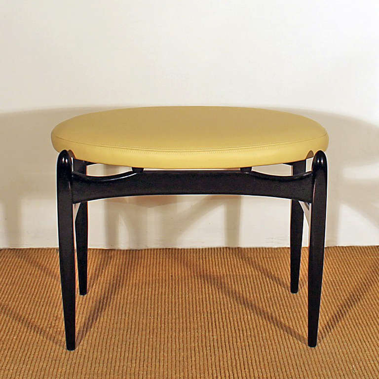 Exotic wood stool, stained and french polished, ivory leather upholstery.
Italy c. 1950