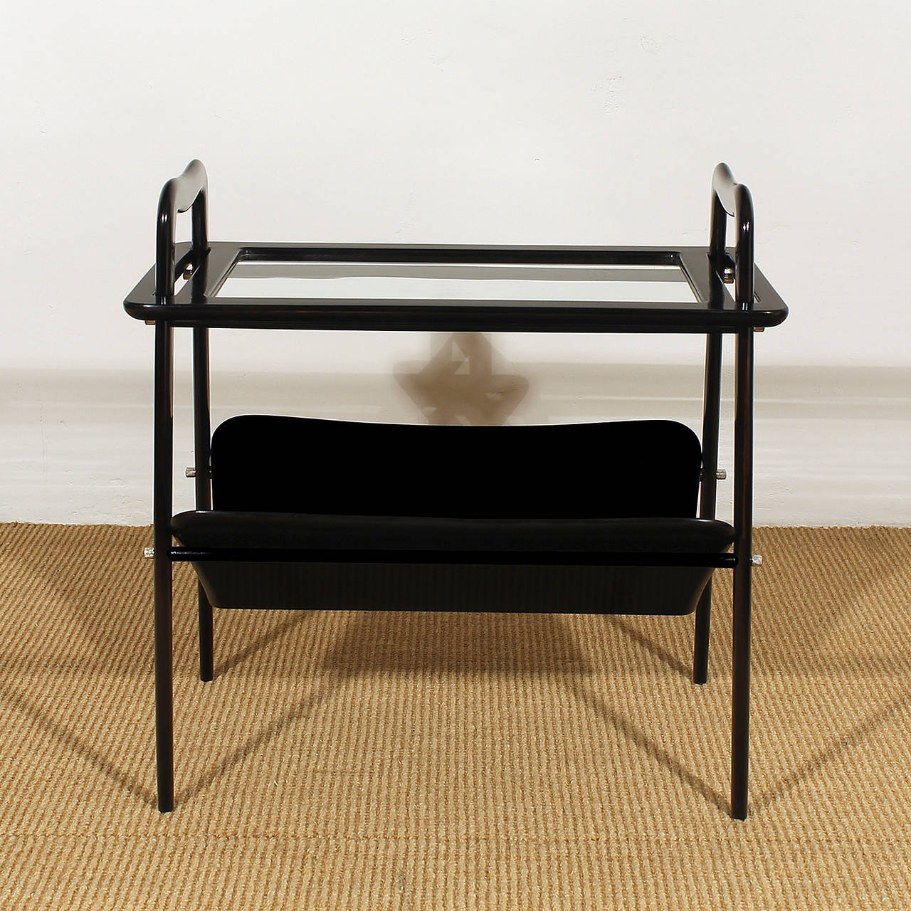Small sidetable and magazine rack, removable tray on top, french polished and stained beech wood, polished brass hardware.

Design: Ico Parisi 

Italy c. 1950
