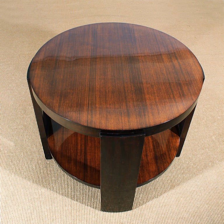 Art Deco round sidetable, zebrawood, 4 mahogany stands.
Italy c. 1930