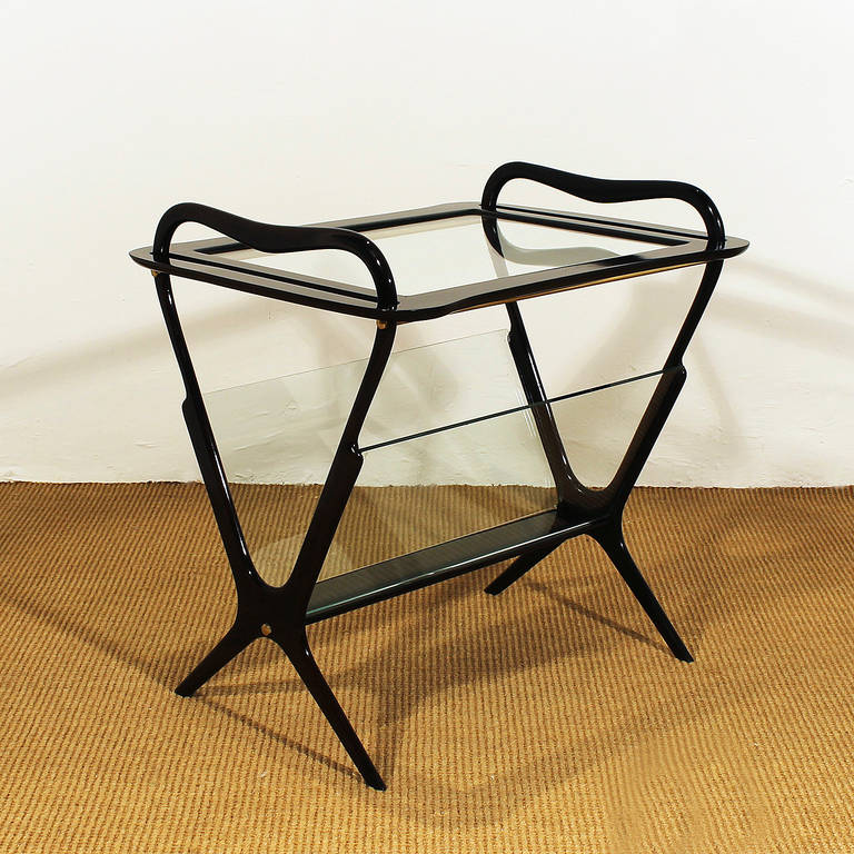 Small table - magazine rack, stained mahogany, french polish, removable tray on top, brass hardware.
Design: Ico Parisi
Manufacturer: De Baggis
Italy 1956