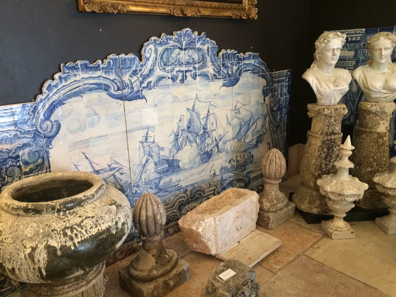 Azulejos mural of the 18th century in cobalt blue over white, manufactured in Lisbon with 234 tiles. The frame is composed of assymetrical shells and pilasters on each side. The center of the piece portraits a navy battle between two different