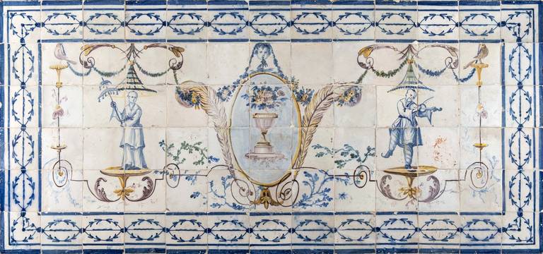 Polychromed pair of neoclassical tile panels with Pillment style chinoiserie, representing Chinese dancers and musicians on both sides, birds, wreaths and a central urn with flowers. Wooden framed.