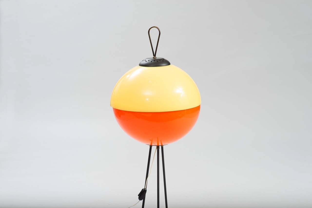 Tripod floor lamp in bicolor acrylic and black painted metal.