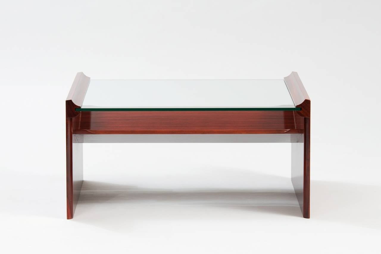 Rosewood and glass coffee table.