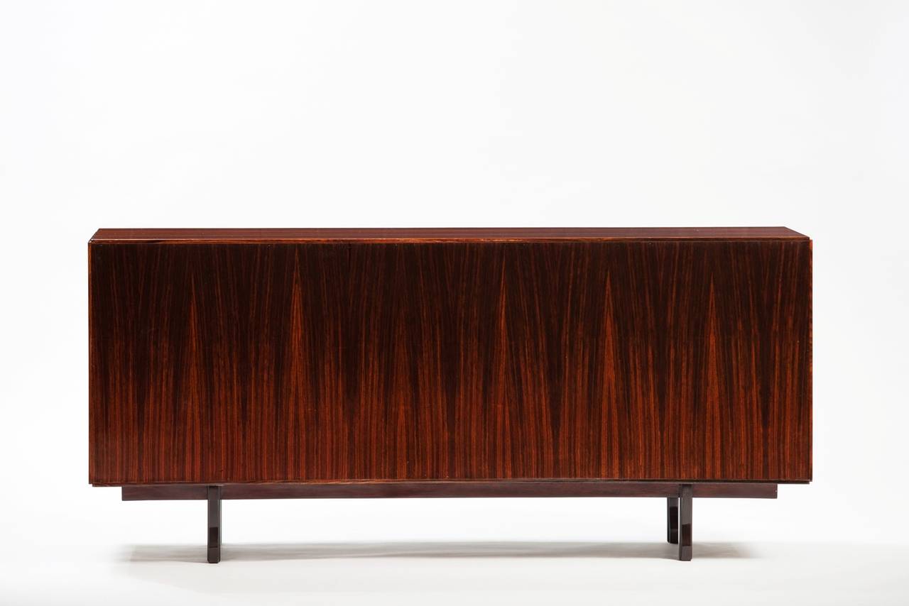 Rosewood sideboard, this item is finished on the back so it can be used as room divider
Bibliography: Abitare 58 (Ottobre 1967), publicità.