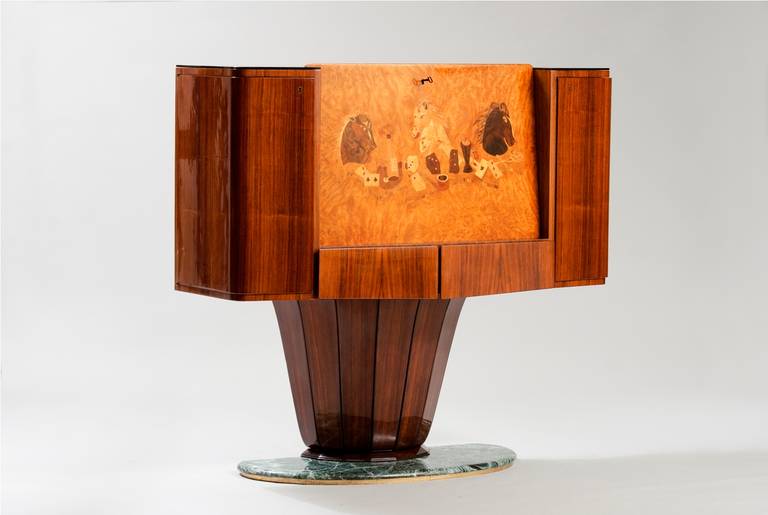 Cocktail cabinet with hinged marquetry fall enclosing fitted interior, rosewood, black glass, and marble
Literature: Irene de Guttry & Maria Paola Maino, Il Mobile Italiano degli Anni ’40 e ’50, Rome, 1992, p.6, pl.5 (design illustrated).