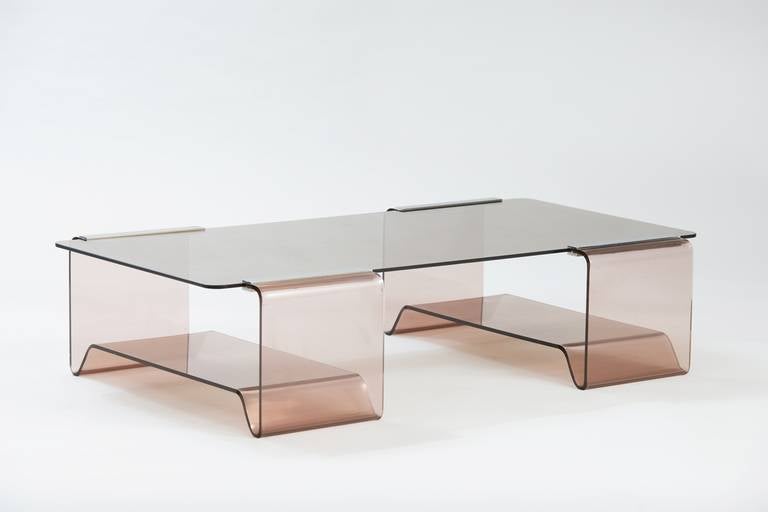 Thermoformed plexiglas, smoked glass and chromed metal coffee table.