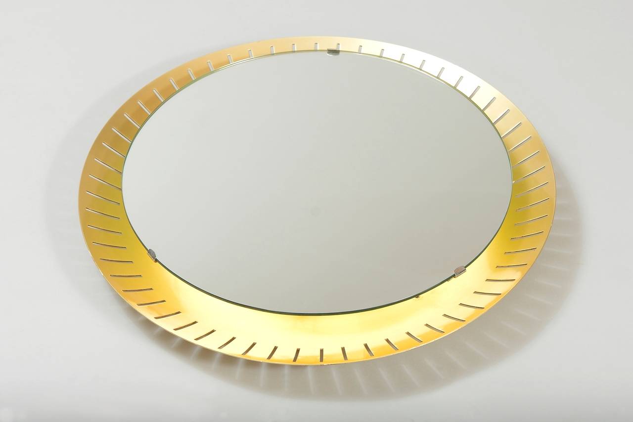 Round pierced aluminium frame mirror with a neon circle light behind the mirror.