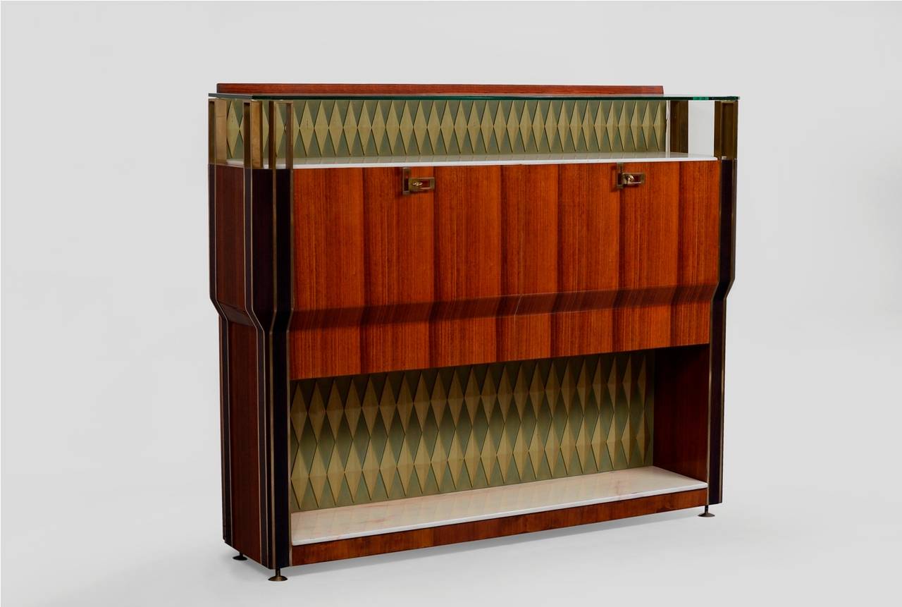 Exceptional bar cabinet in rosewood with brass fittings, decorated with bicolor lozenges, upper top in glass and lower top in marble top, it has interior lighting when open.