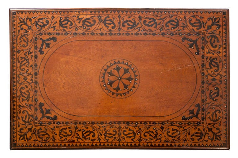 Indo-Portuguese table. Teak, sissoo and ivory. Pierced metal mounts.
90 cm. X 58 cm. X 77 cm. High.
17th century.

Indo-Portuguese furniture. These pieces are a result of the Portuguese expansion of the 16th and 17th centuries to the orient
