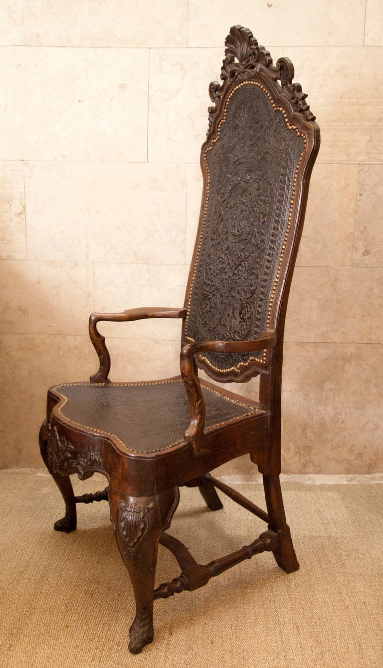 A pair of Dom João V armchairs. Walnut, engraved and studded leather in the seats and back depicting mythological figures.
Portugal, first half of the 18th century.

D. João V period (1707-1750) furniture. Greatly influenced by English furniture