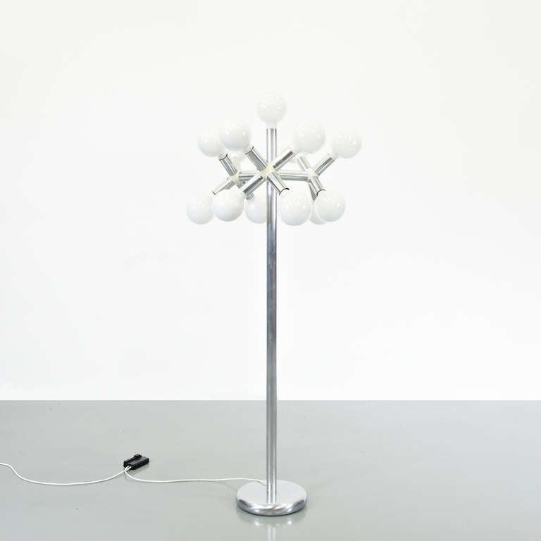 Floor lamp designed by Trix & Robert Haussmann in 1950.
Manufactured by Swisslamps International (Sweden)
Chromed metal base and structure and bulbs.

In good original condition, with minor wear consistent with age and use, preserving a