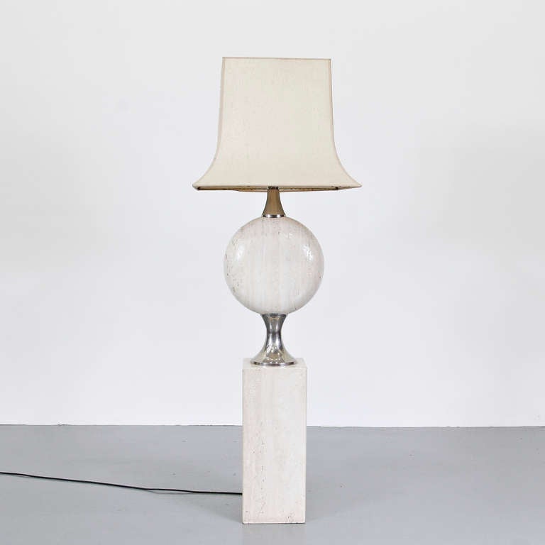 A beautiful, rare floor lamp designed by Maison Barbier, manufactured in Paris (France), circa 1970.

This stunning piece has a solid travertine base with chrome-plated details. It has the original hood, giving the piece an especially luxurious