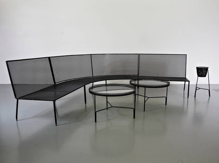 Extremely rare and very large sofa designed by Mathieu Matégot, manufactured by Ateliers Matégot in France, circa 1950.

This stunning piece is completely made of the highest quality black lacquered metal. The seats and backrests are perforated