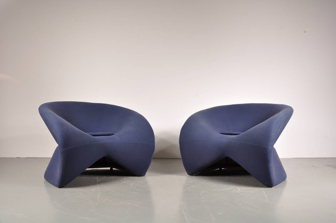 Eye-catching set of two large easy chairs in the style of Pierre Paulin, circa 1970.

These beautiful, organic shaped pieces are very well-crafted. They have their original blue upholstery that is still in great condition. Finding more information