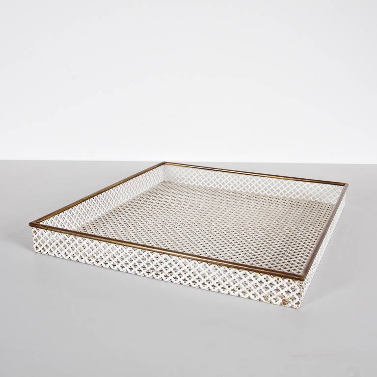 Enameled metal tray designed by Mathieu Mategot.
Manufactured by Artimeta (Netherlands) circa 1950.
Lacquered perforated metal with original paint and brass detail. 

Artimeta had the rights to manufacture and sell Mategot products in The
