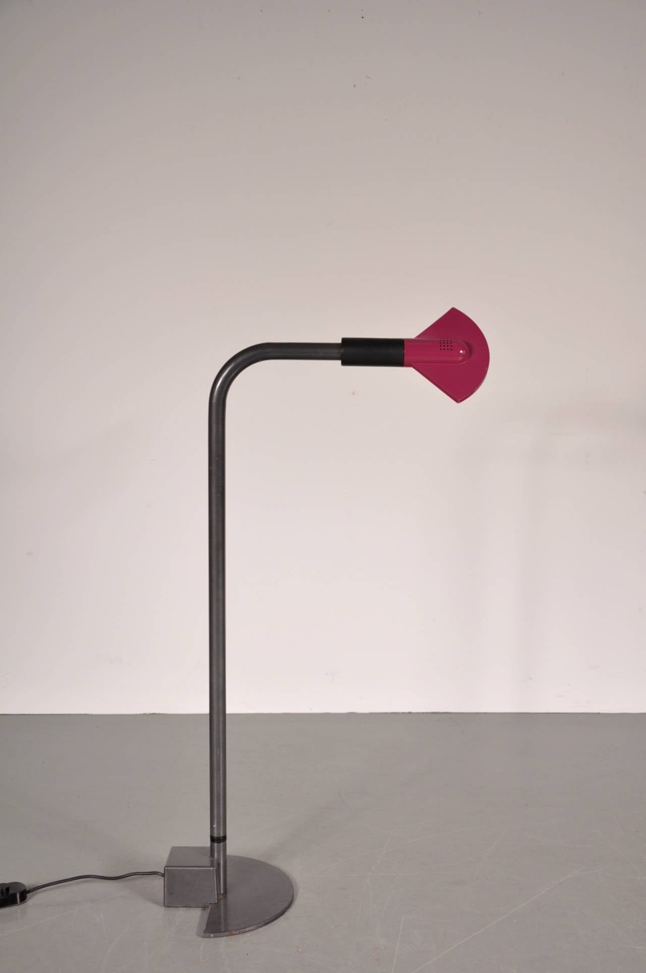 Rare Memphis style adjustable floor lamp by Hans von Klier, manufactured by Bilumen, Italy, circa 1980.

The lamp has a high quality metal base that is easily adjustable in height up to 140 cm. The purple aluminium hood has a unique shape, making