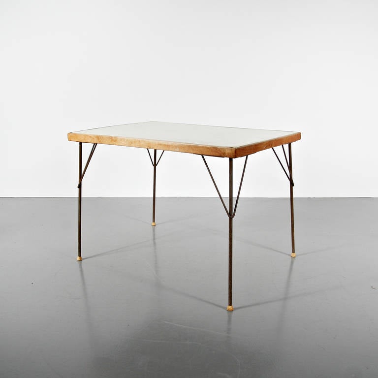 Table designed by Wim Rietveld in 1959.
Manufactured by Ahrend de Cyrkel (The Netherlands).
Lacquered metal frame, vinyl table top.

In good original condition, preserving a beautiful patina. 

The table top vinyl is a bit distressed, it might