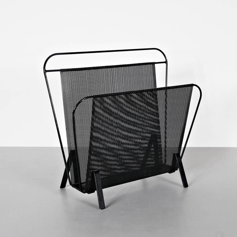Magazine holder, model Harpers, designed by Mathieu Matégot.
Manufactured by Artimeta (Netherlands) circa 1950.
Folded, perforated metal.

In good original condition, with minor wear consistent with age and use, preserving a beautiful