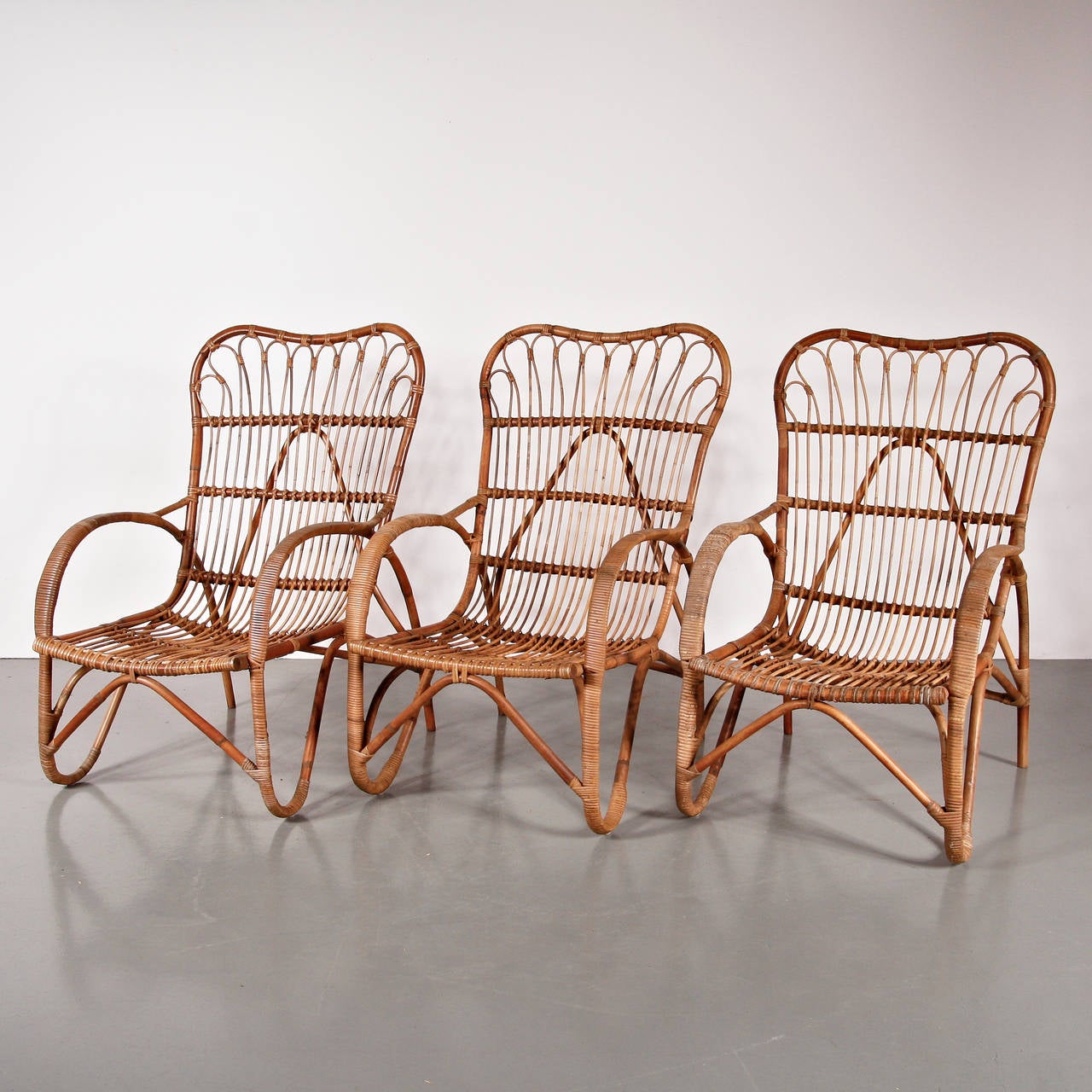 Set of three rattan armchairs designed by Dirk van Sliedrecht, circa 1960.
Manufactured in the Netherlands.

All in Rattan in perfect original vintage condition with a beautiful patina.