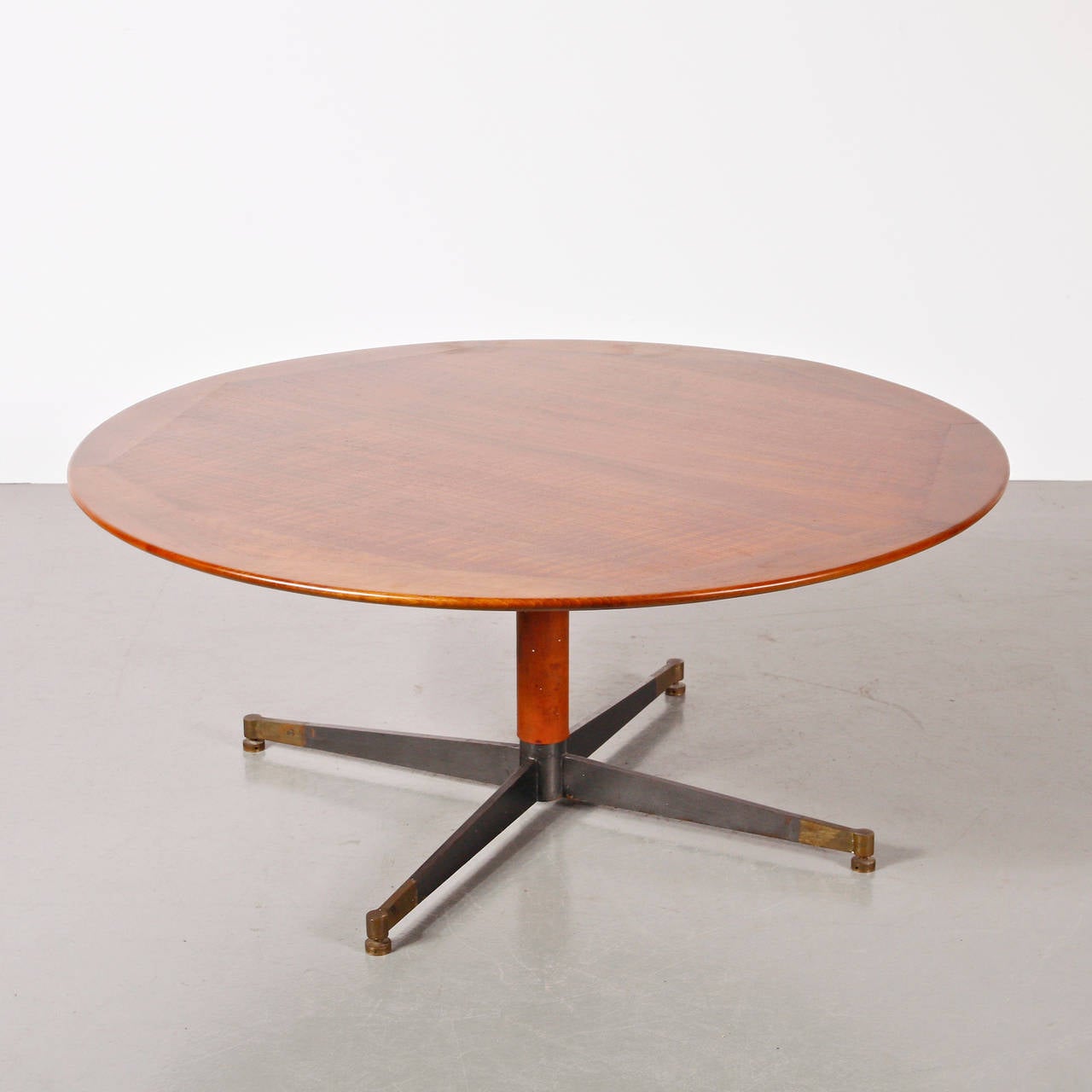 Coffee table designed by Jacques Adnet.
Manufactured in France, circa 1950.
Oak table top, lacquered base and structure with leather and brass details.

In good original condition, with minor wear consistent with age and use, preserving a