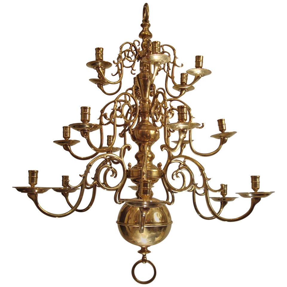 A large three tiered brass Dutch chandelier