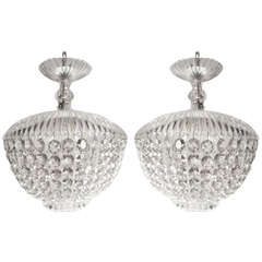 A pair of glass and crystal ceiling lights