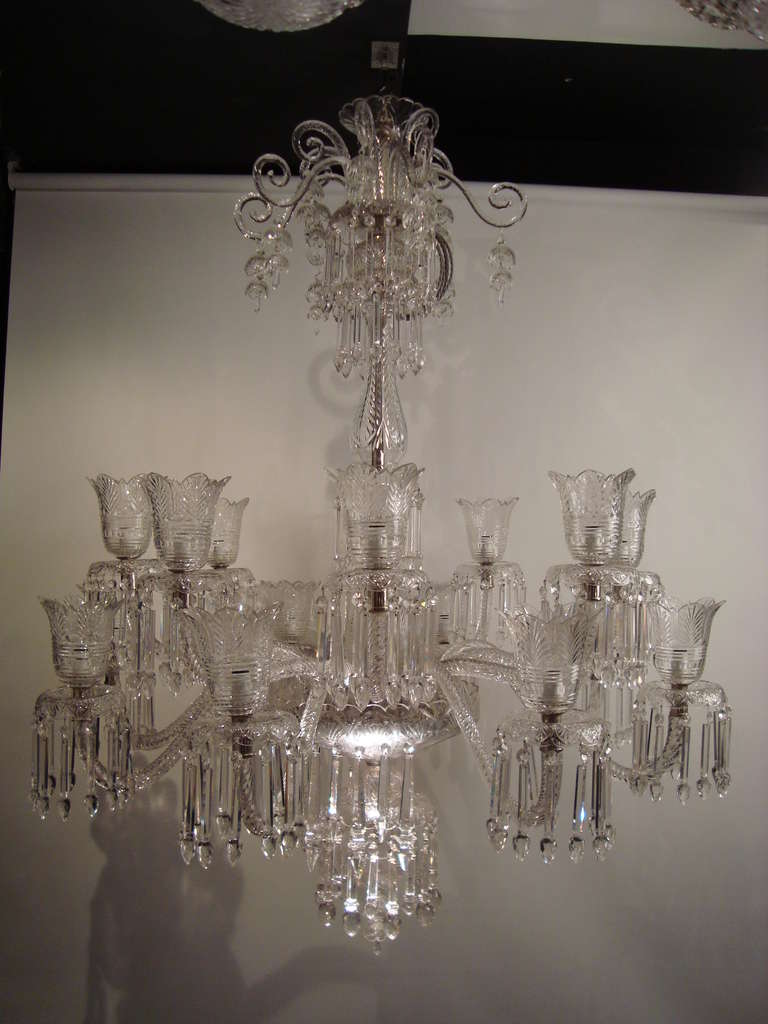 A very large two tiered 16 armed cut glass chandelier, the twisted rope glass armed supporting with large tulip shaped cut glass shades, in the manner of Osler of Birmingham.
