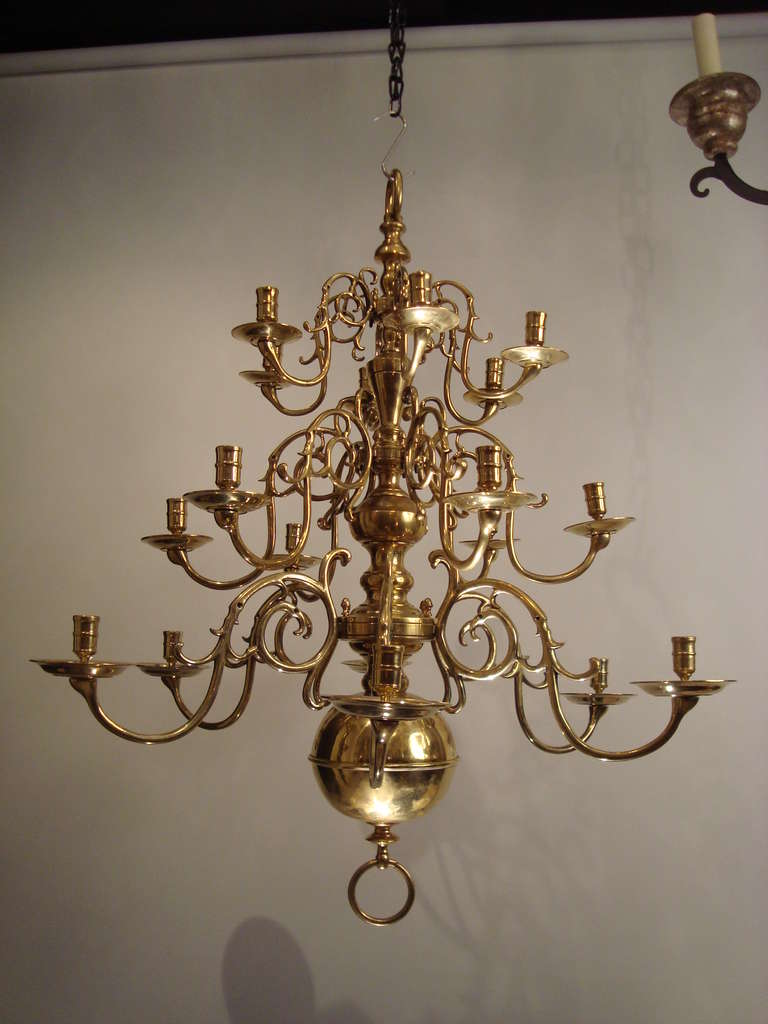 A large three tiered, 18 armed brass chandelier, probably Dutch, Circa 1860