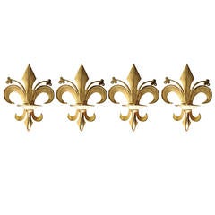 A set of 4 fleur de lys wall lights