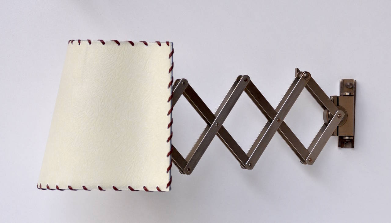 Adjustable accordion appliques by Alfred Muller for AMBA circa 1950. The system attains a maximum projection of 39