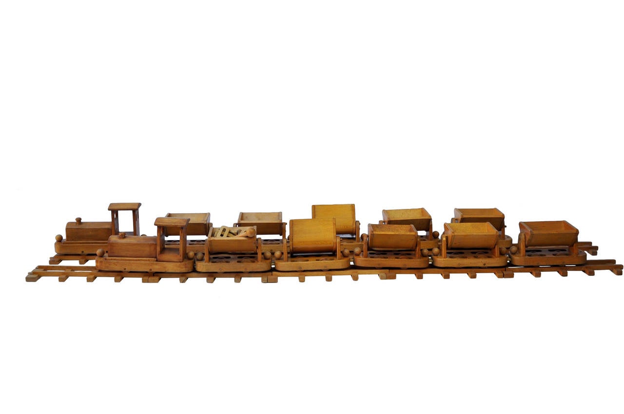 An extensive wooden train set by Holz Vieles In Finem.
The set consist of 54' 1/2