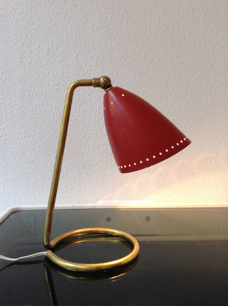 Little 1950s French cocotte, articulated red painted shade, brass base.