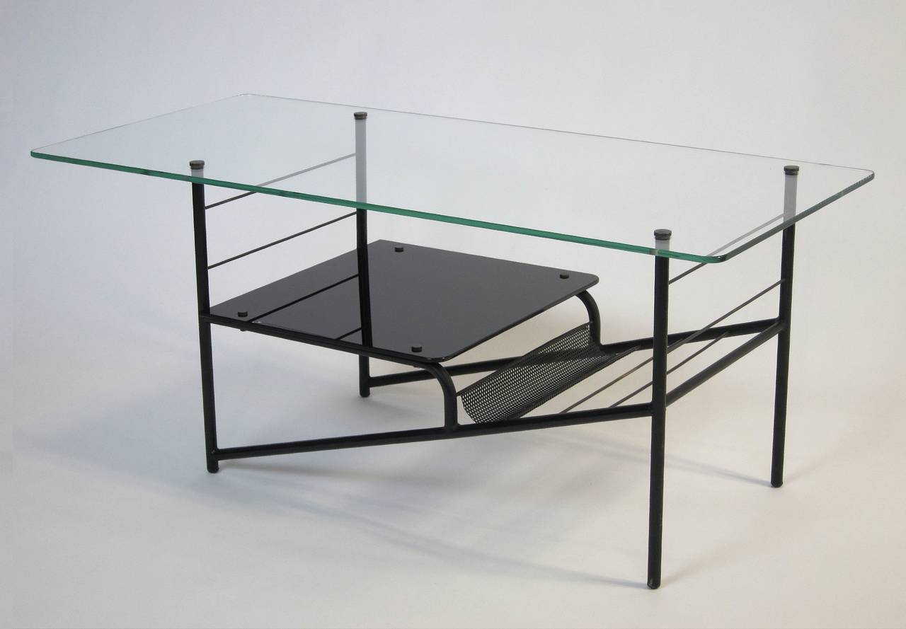 Coffee table in black lacquered iron, brass, black glass, glass,
Manufactured in France, 1960s.