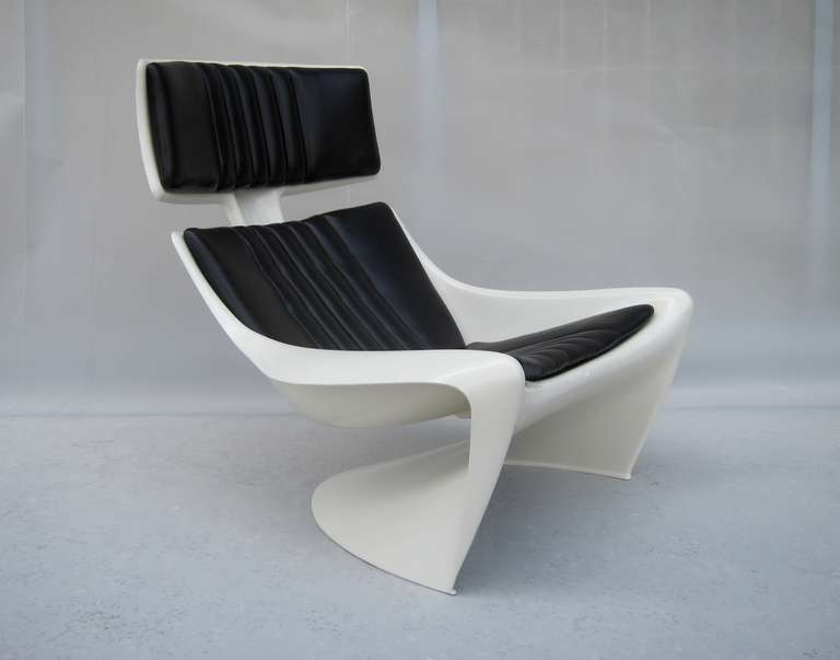 Pure 1970's design from Denmark, Star Trek approved antilever chair in molded fiberglass with black leather upholstery, adjustable headrest, restored.