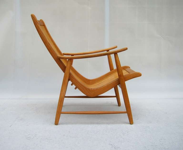 Jacob Müller's simple but inspired and light armchair, frame in ashwood, seat in plywood, produced by Wohnhilfe Switzerland 1950. This exemplar has a high back. The seat can easily be placed in 3 different positions.