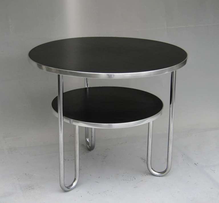 Beautiful and heavy Coffeetable manufactured by Mauser Werke Germany in the 1950s, black linoleum tops in very good condition, edged by an aluminium shape, three chrome-plated legs