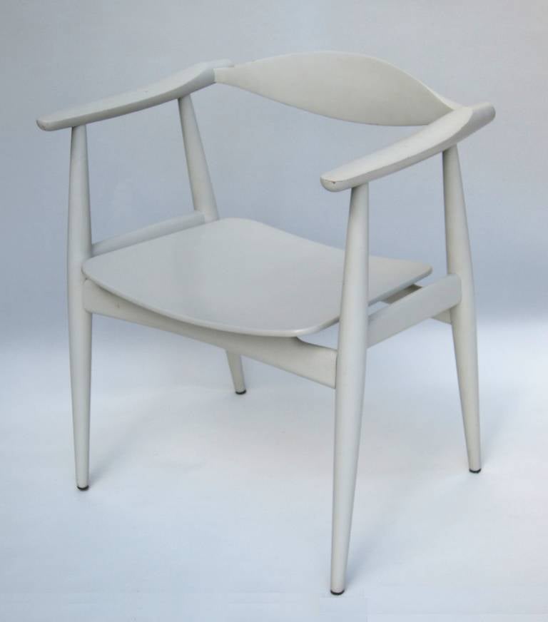 Designed in the 1950s by Hans J. Wegner, this rare and original light grey painted chair was manufactured by Carl Hansen in the 1960s.