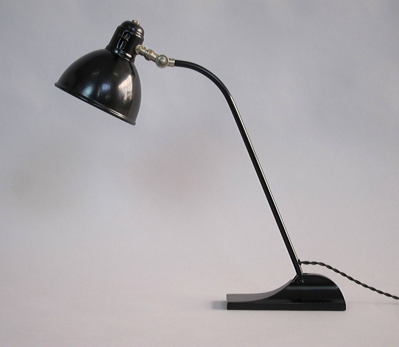 Large Desk Lamp with a heavy and stable Iron Base, the Inside of the Shade is white enameled, manufactured by BAG Turgi Switzerland 1930's, restored.