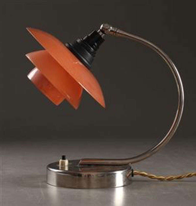 Table lamp, nickel-plated stem fitted with Poul Henningsen PH 1/1 pendant with old matt glass shade set painted pink . Lamp stem from c. 1940, shade set from c. 1940. H. 23 cm.