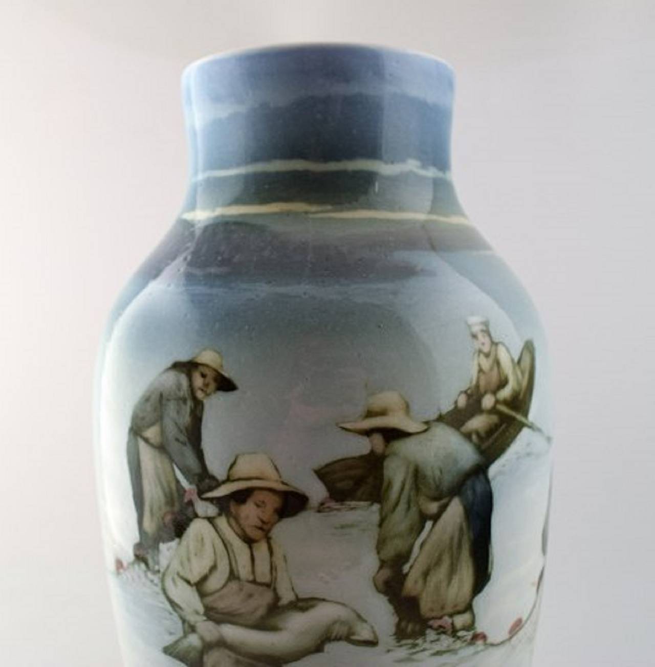 Large Art Nouveau unique Ro¨rstrand Nils Emil Lundstro¨m (1865-1960) porcelain vase. Decorated with fishermen.
38 cm height. Beautiful vase of high quality.
Signed Ro¨rstrand and NL.
In very good condition.